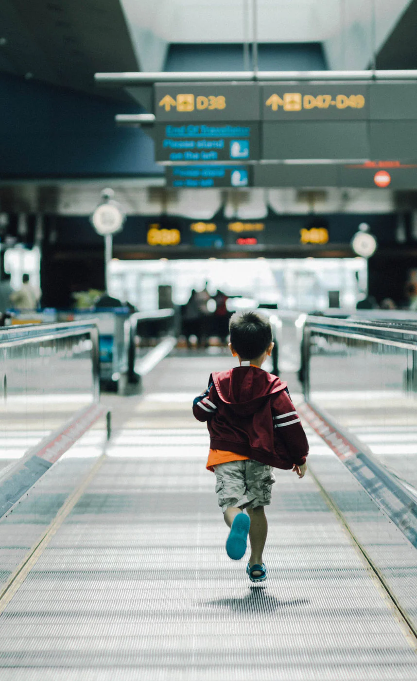 Rolling luggage through the terminal