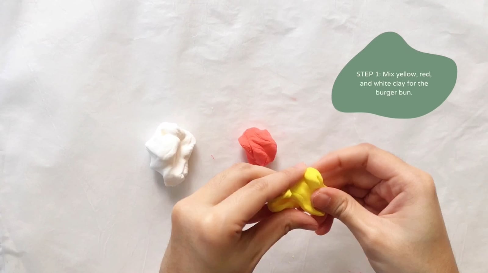Step 1 of the DIY clay burger tutorial: Mix yellow, red, and white clay for the burger bun.