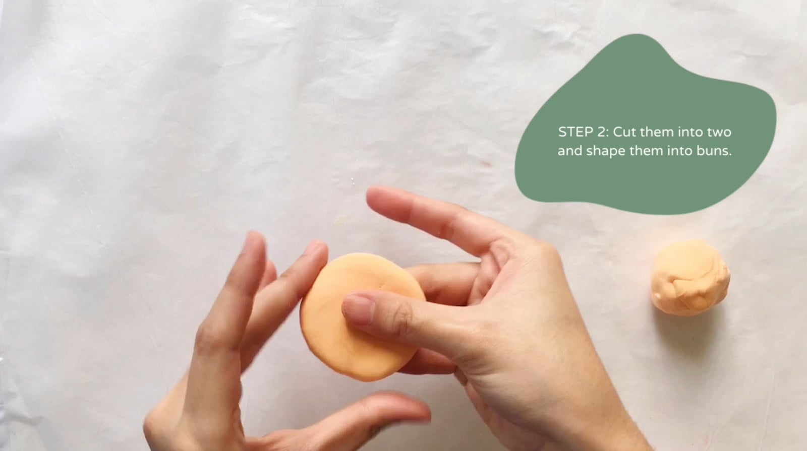 Step 2 of the DIY clay burger tutorial: Cut them into two and shape them into buns.