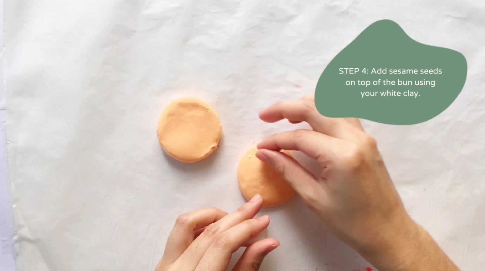 Step 4 of the DIY clay burger tutorial: Add sesame seeds on top of the bun using your white clay.