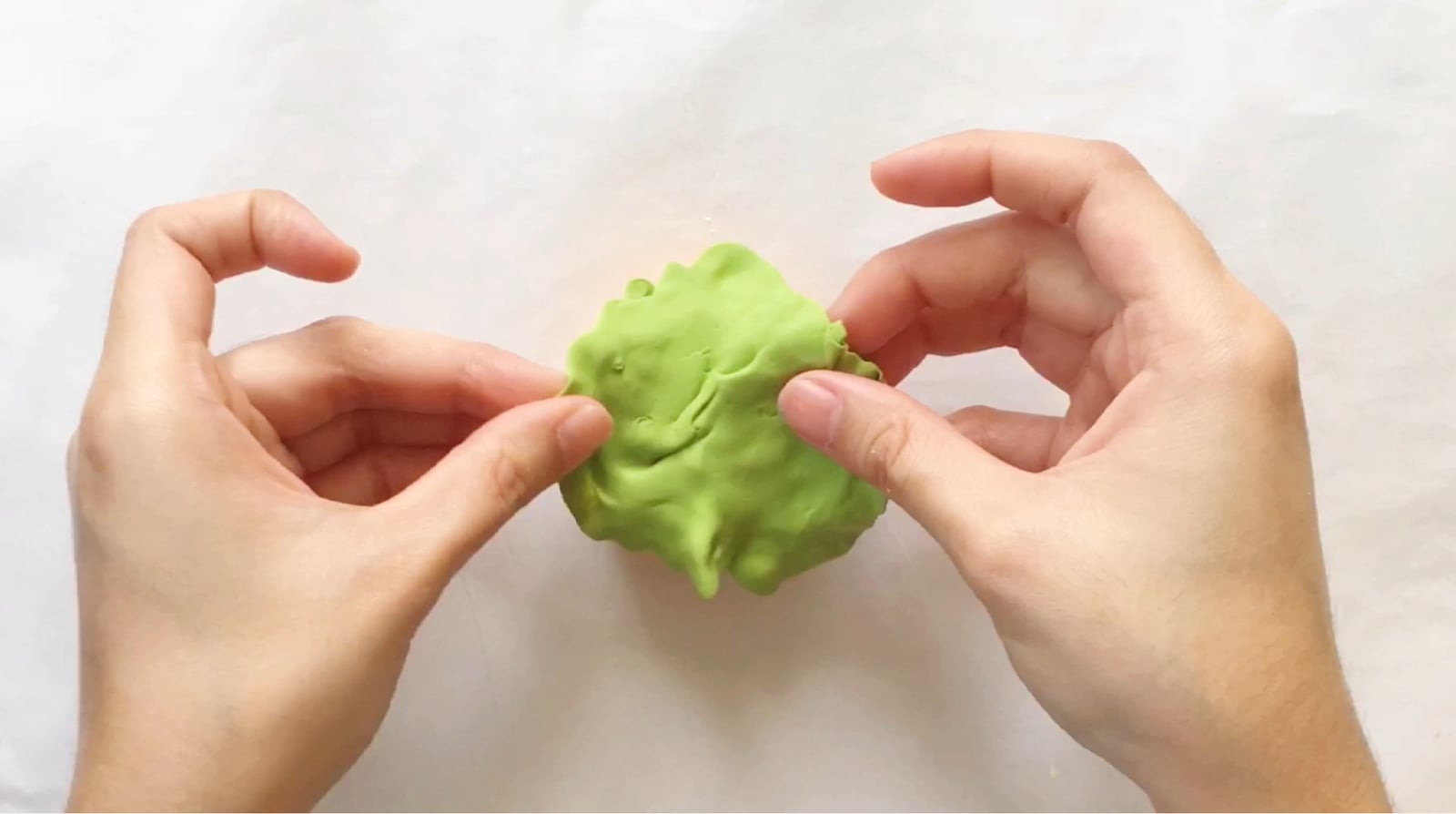 Step 8 of the DIY clay burger tutorial: Mix yellow and blue clay for the lettuce and put it on top of the patty.