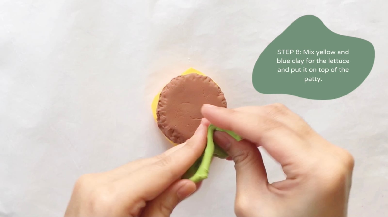Step 8 of the DIY clay burger tutorial: Mix yellow and blue clay for the lettuce and put it on top of the patty.