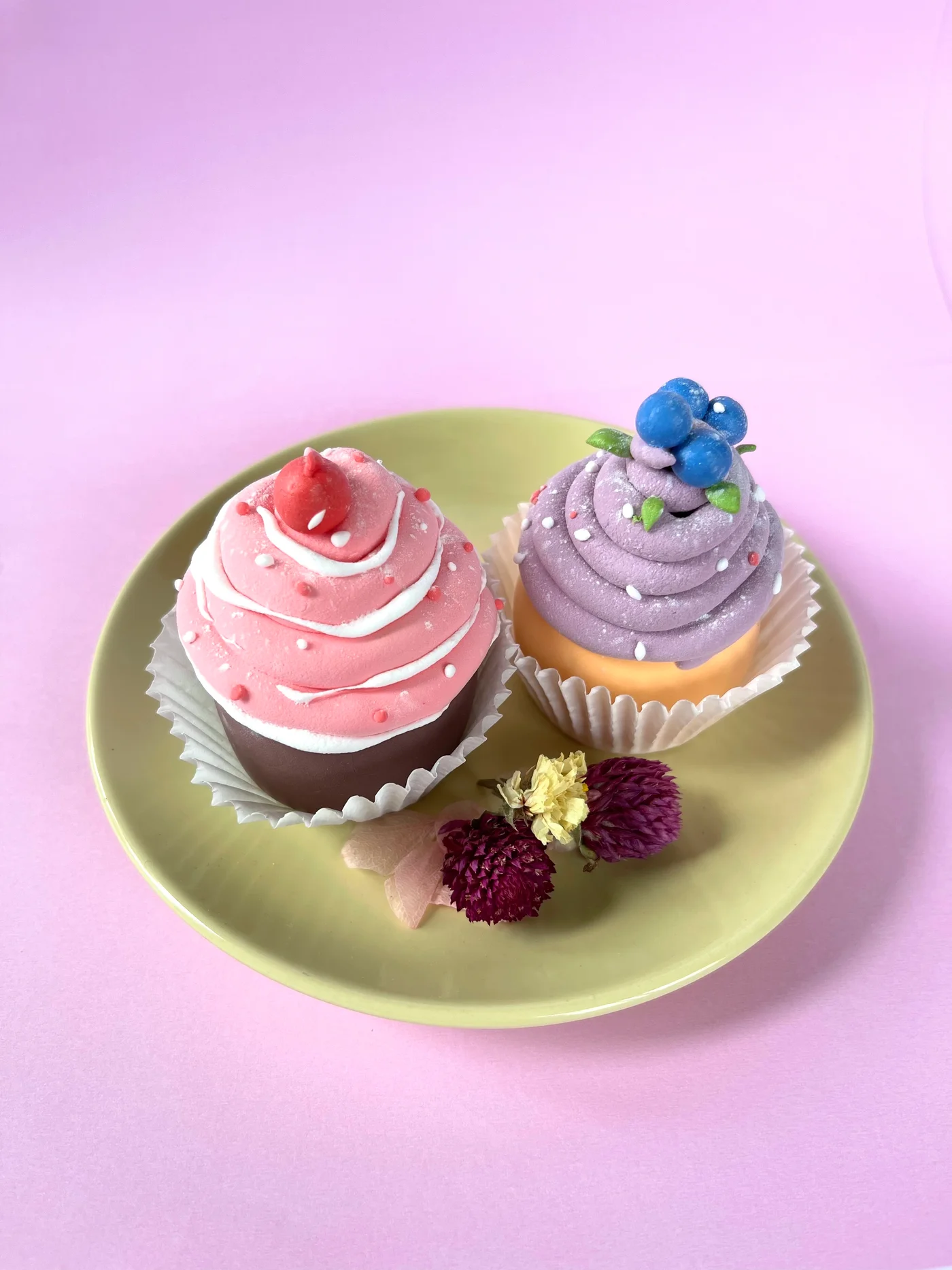 Air-dry clay cupcakes with strawberry and blueberry frosting, a clay cherry on top
