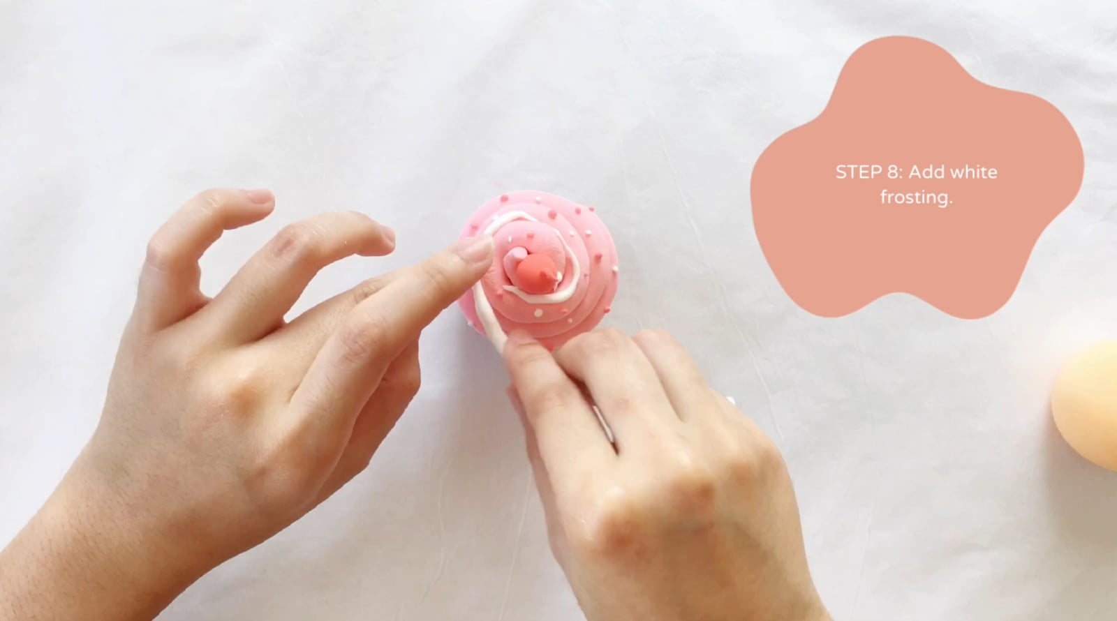 Step 8 of the DIY clay cupcakes tutorial: Add white frosting.
