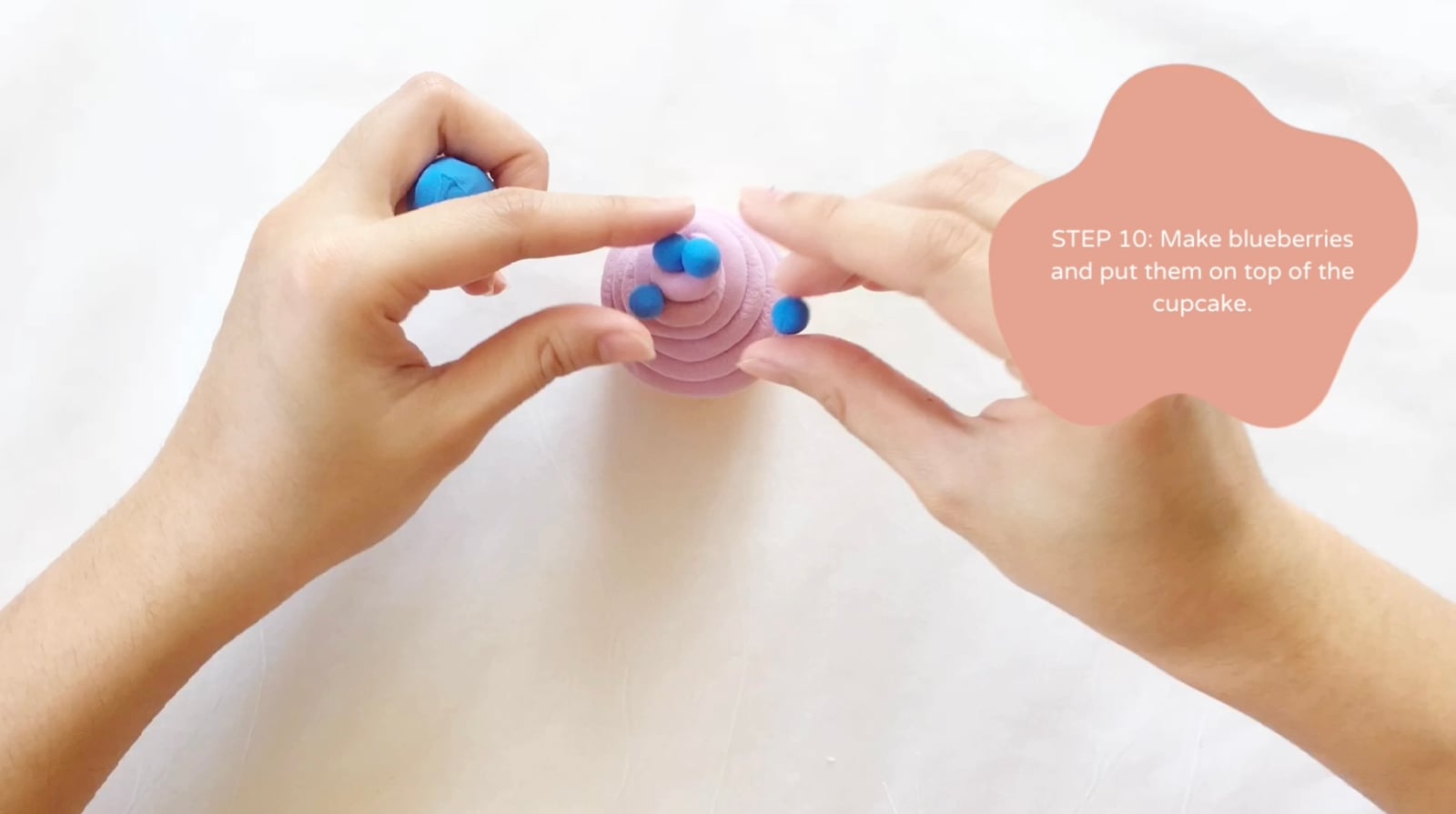 Step 10 of the DIY clay cupcakes tutorial: Make blueberries and put them on top of the cupcake.