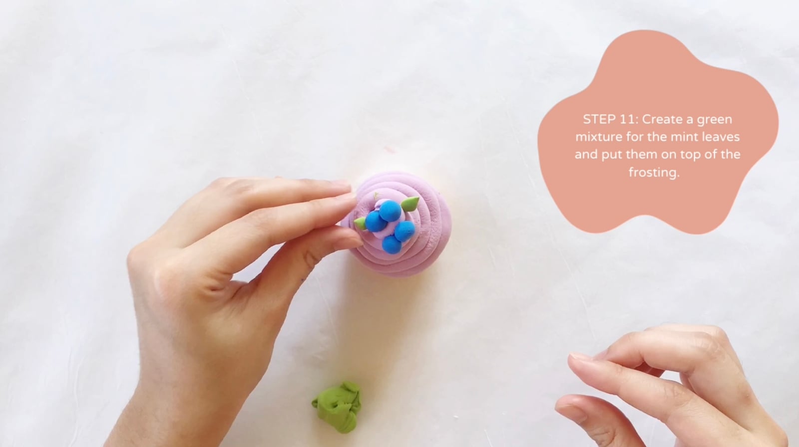 Step 11 of the DIY clay cupcakes tutorial: Create a green mixture for the mint leaves and put them on top of the frosting.