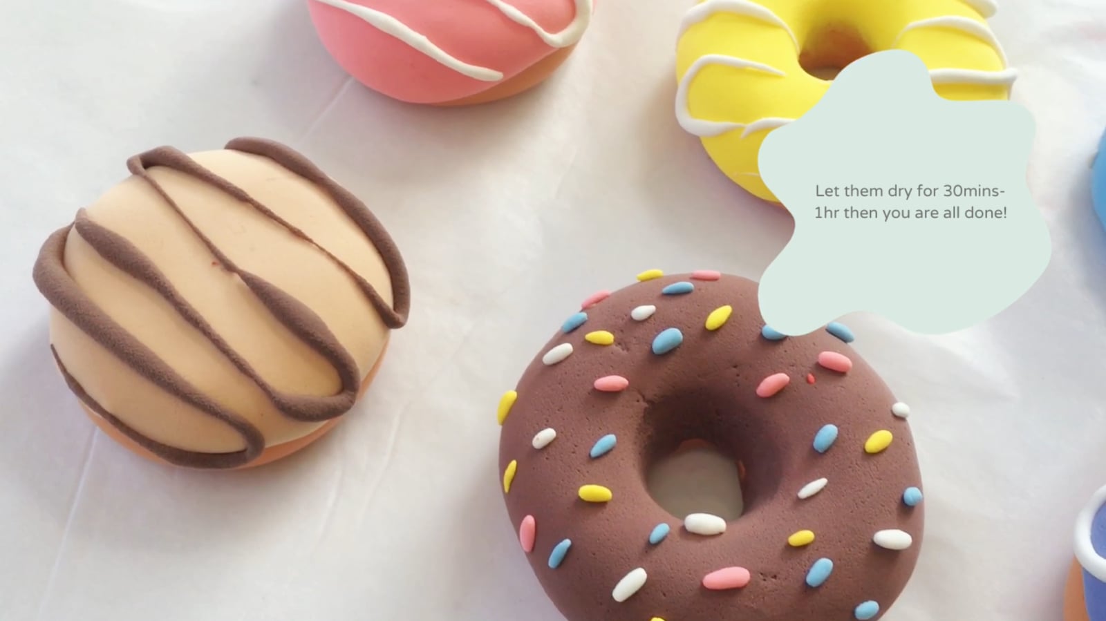 All six flavors of clay donuts laid out to dry