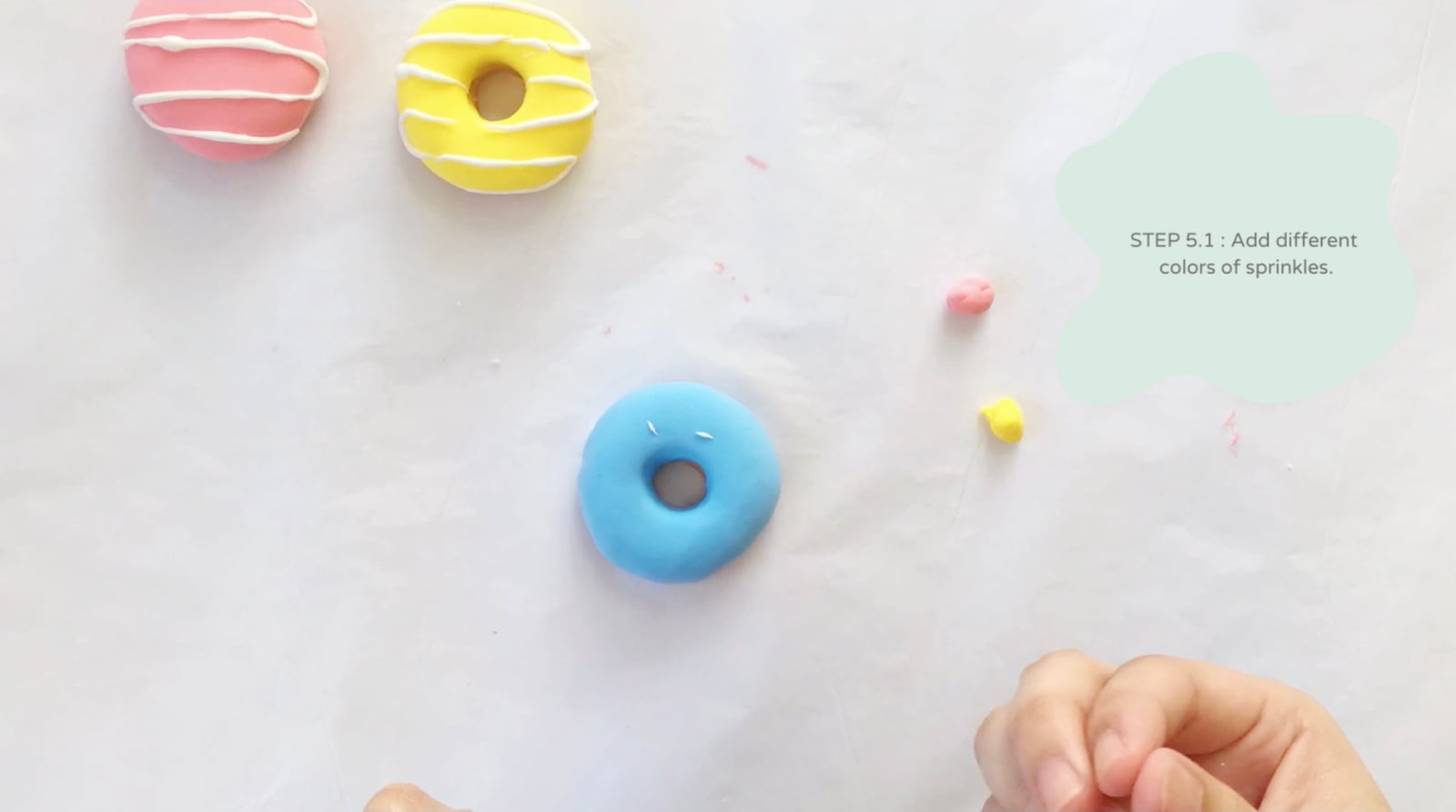 Step 5 of the DIY clay donuts tutorial: Mix blue and white for the blueberry doughnut.