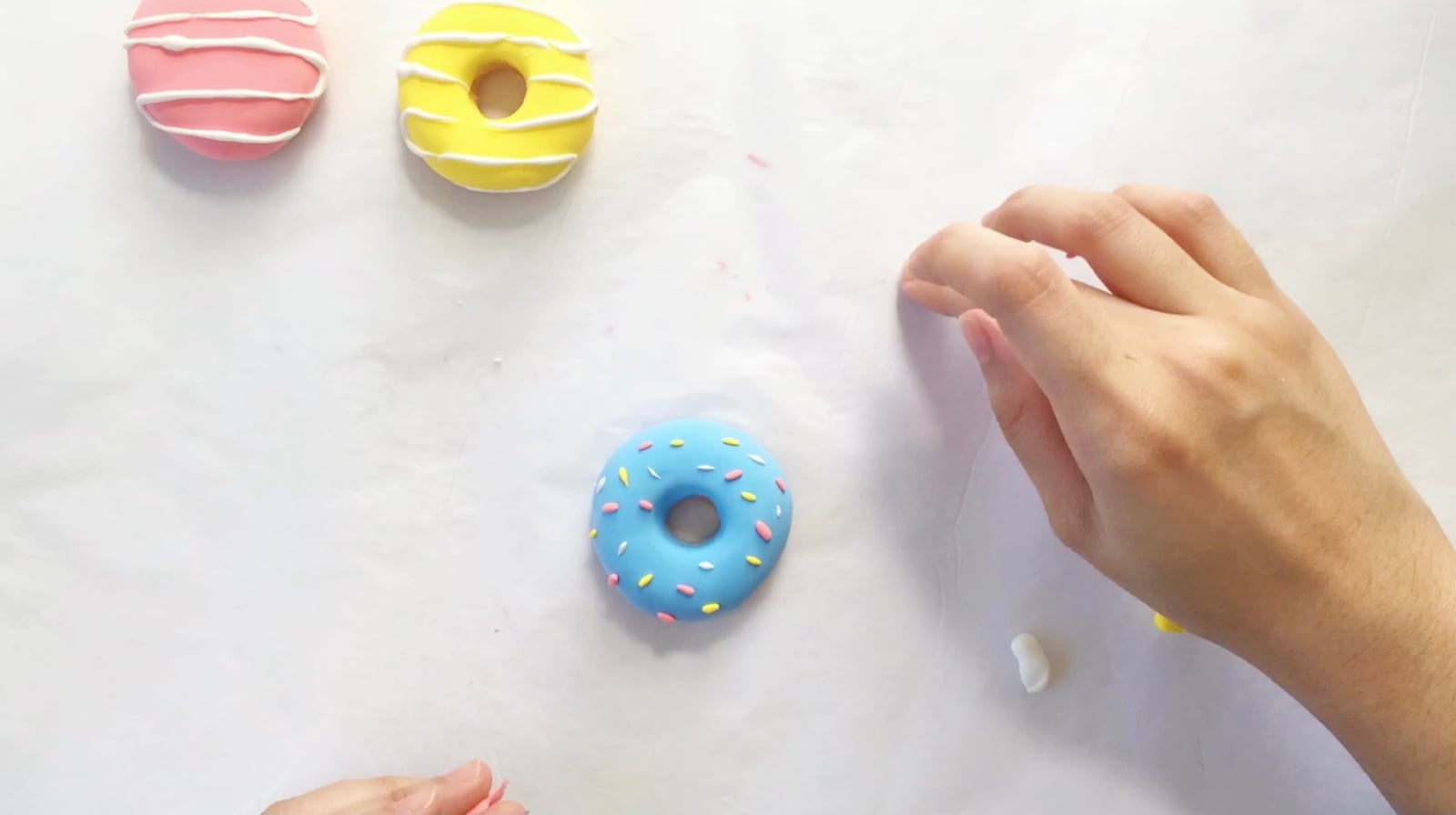 Step 5 of the DIY clay donuts tutorial: Mix blue and white for the blueberry doughnut.