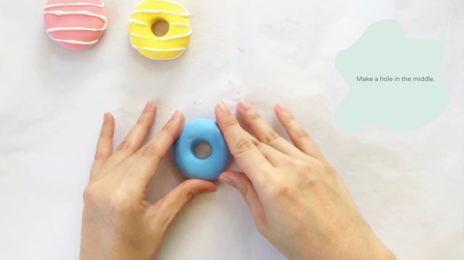 Step 5 of the DIY clay donuts tutorial: Mix blue and white for the blueberry doughnut.