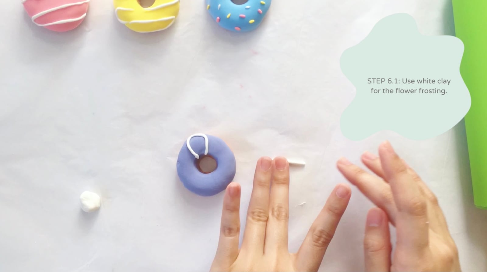 Step 6 of the DIY clay donuts tutorial: Use white clay for the flower frosting.