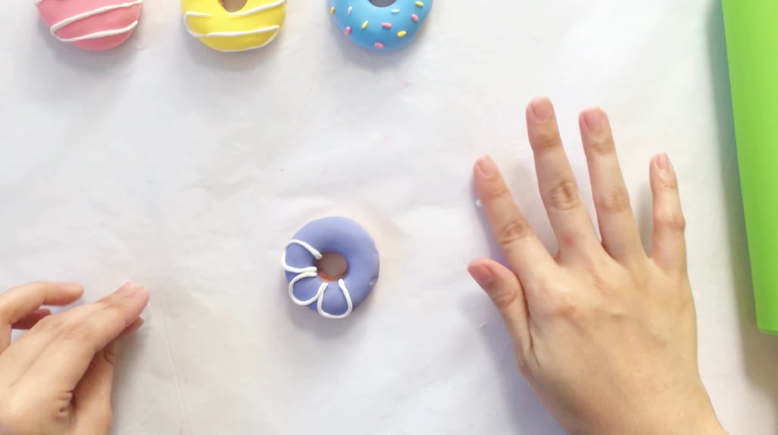 Step 6 of the DIY clay donuts tutorial: Use white clay for the flower frosting.