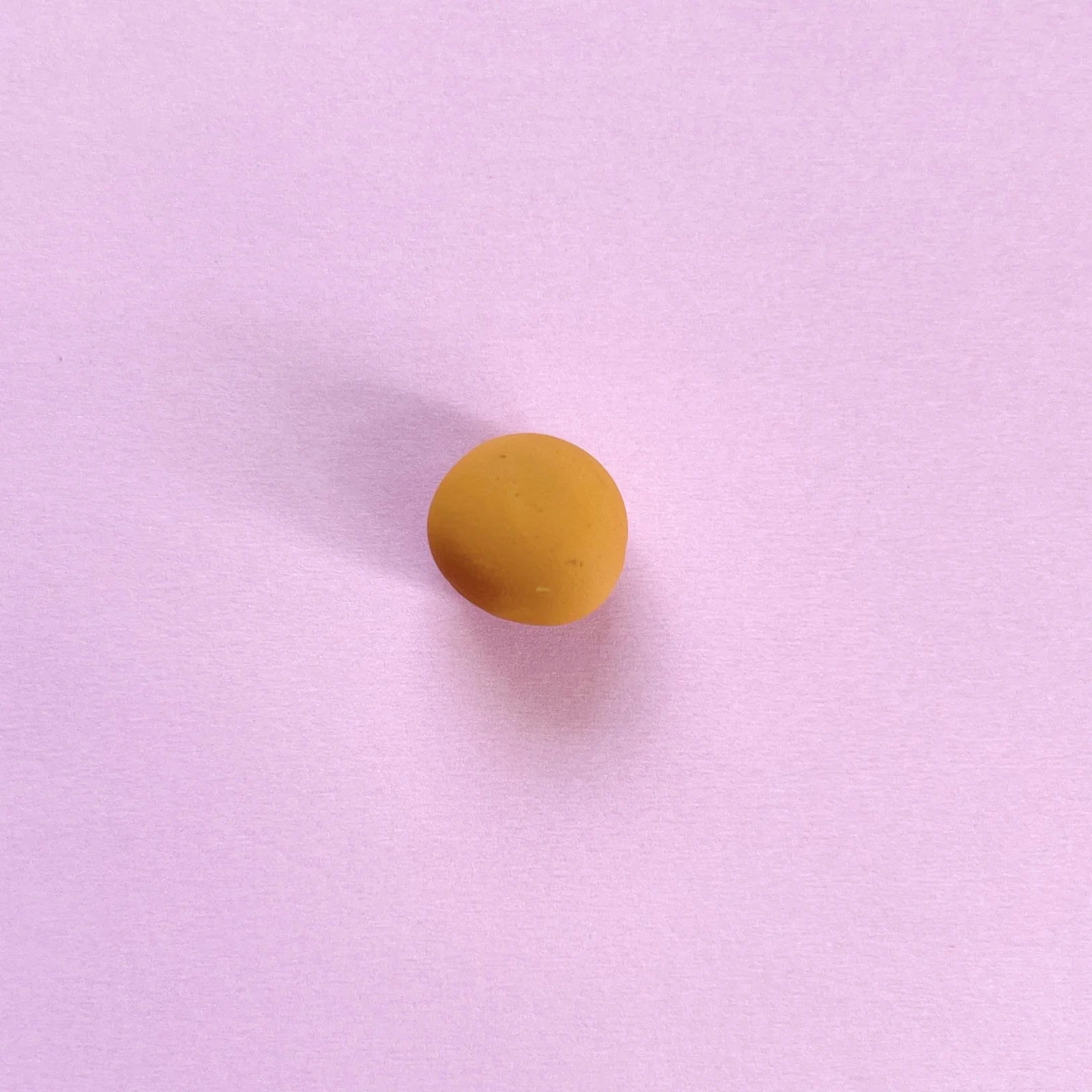 Step 1 of the mini clay animal erasers tutorial: make a small ball for the bear's head