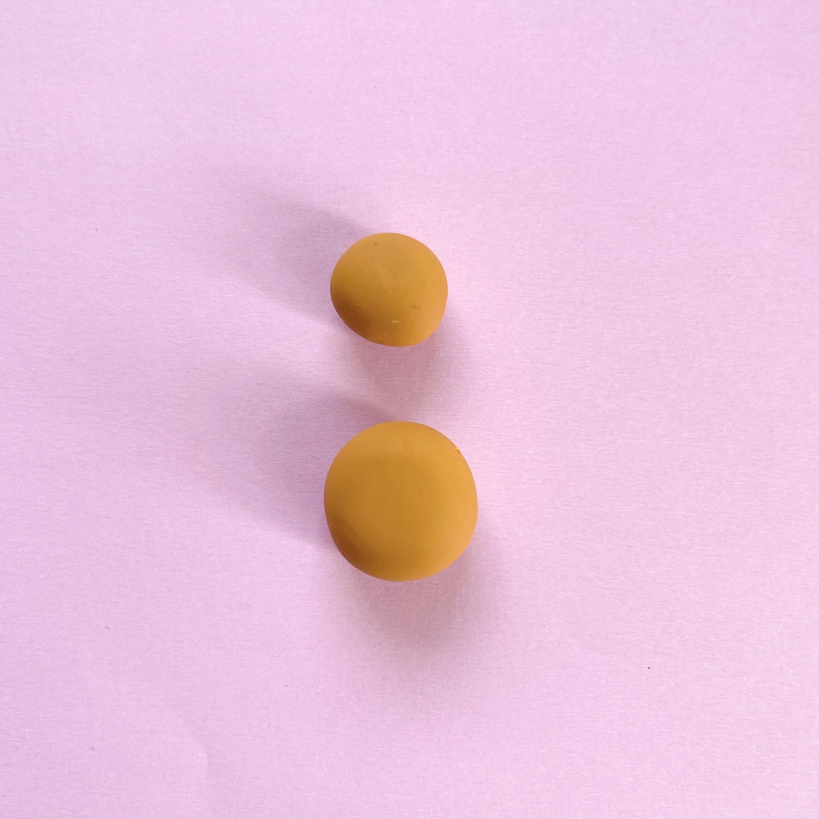Step 2 of the mini clay animal erasers tutorial: make a bigger ball for the body and attach it