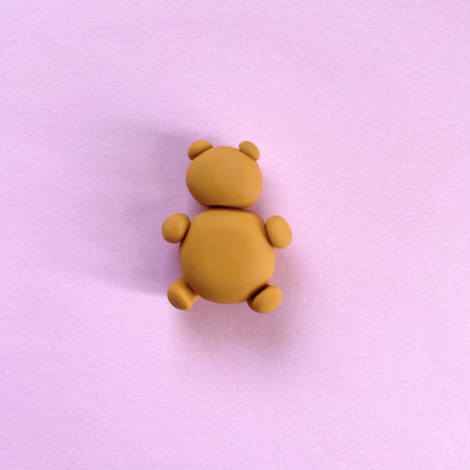 Step 3 of the mini clay animal erasers tutorial: make small balls for the ears, arms, and feet