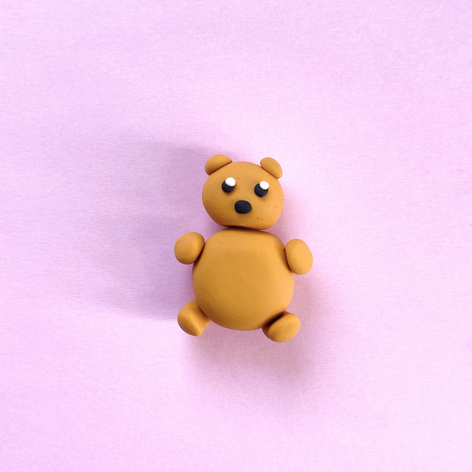 Step 4 of the mini clay animal erasers tutorial: add the bear's eyes and nose