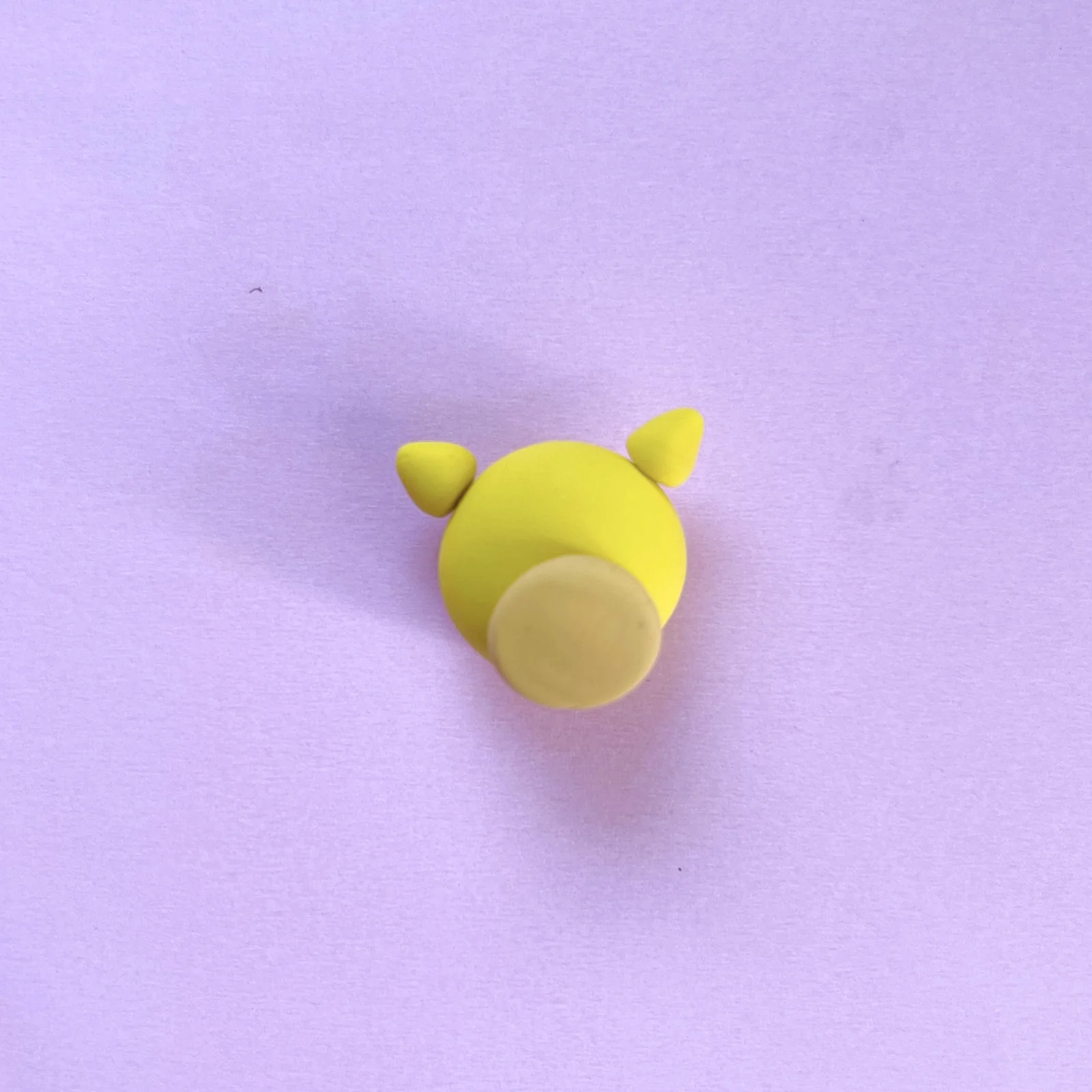 Step 3 of the mini clay animal erasers tutorial: roll and flatten the giraffe's mouth