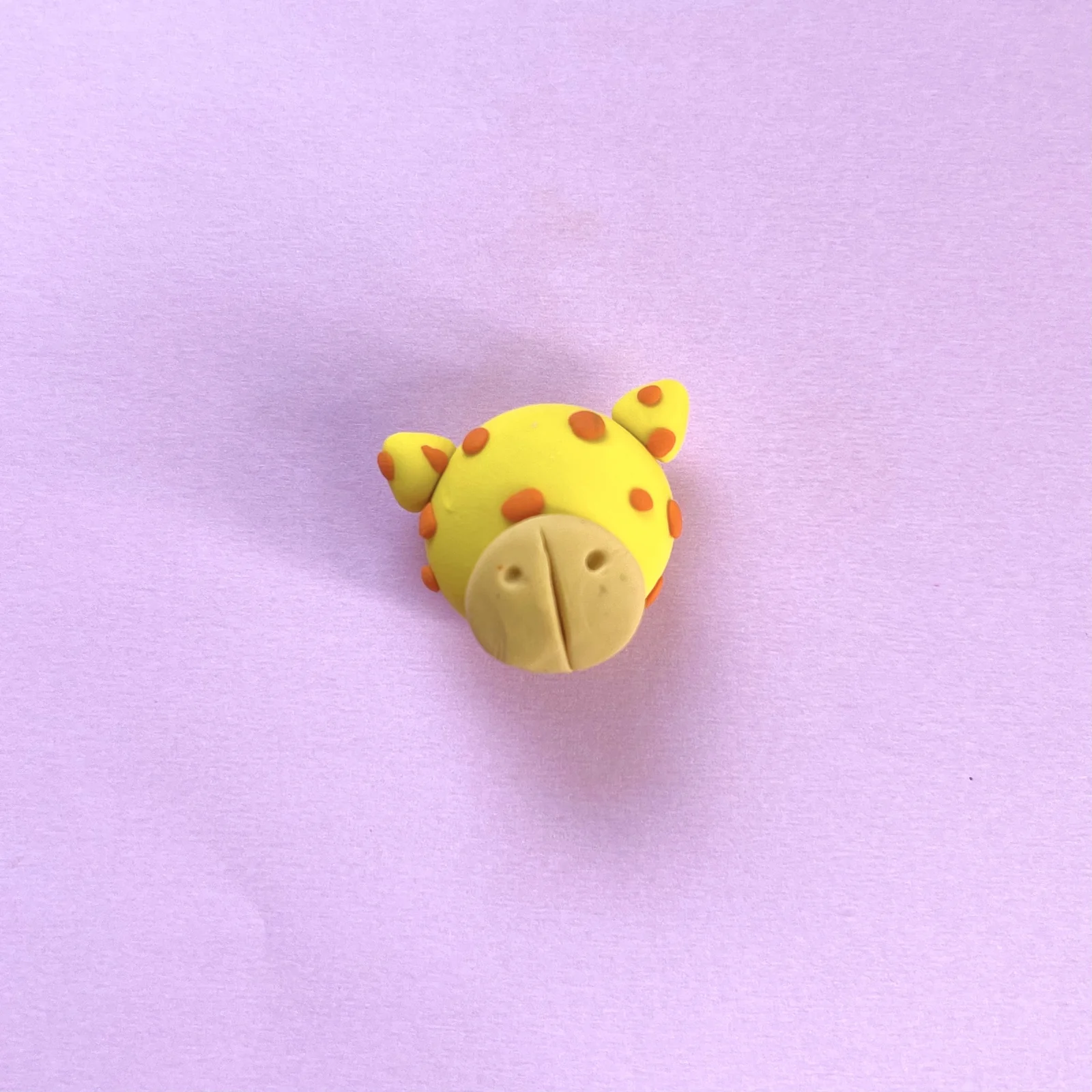 Step 5 of the mini clay animal erasers tutorial: add small circles for the spots