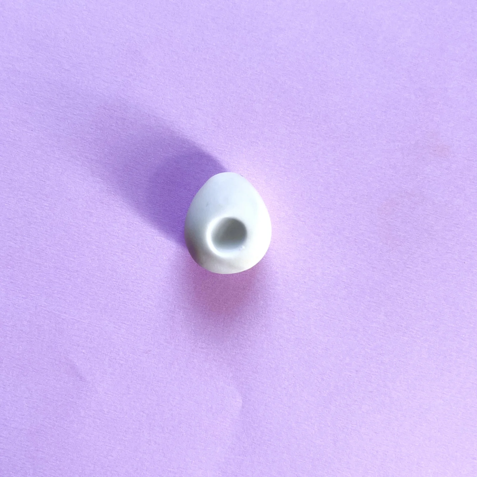 Step 2 of the mini clay food erasers tutorial: make a hole in the middle and add the yellow clay