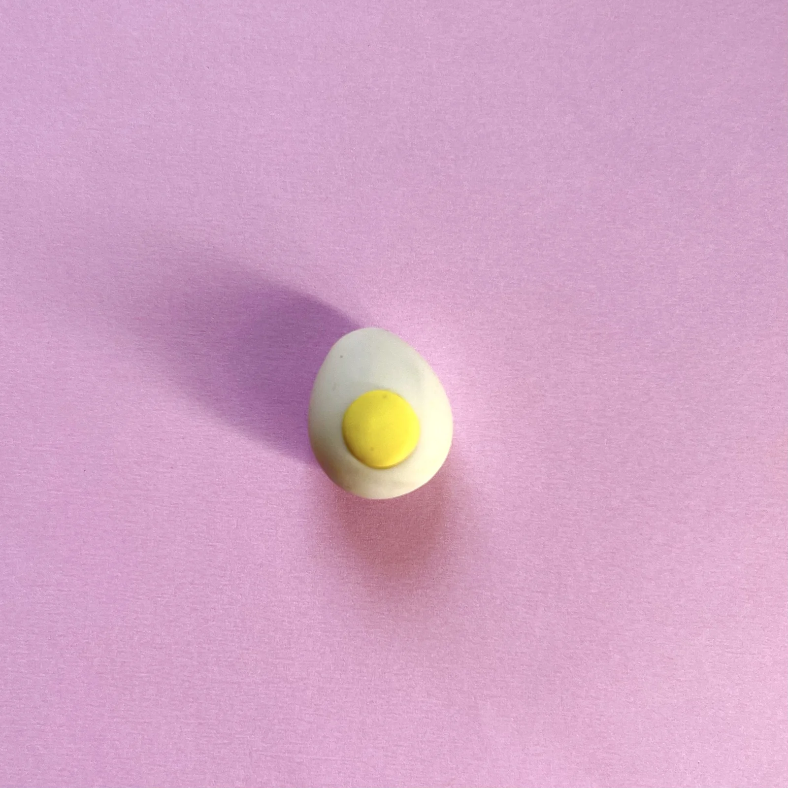 Step 3 of the mini clay food erasers tutorial: add a smiling face with white and black clay