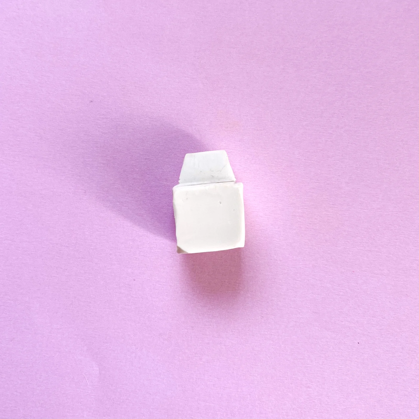Step 1 of the mini clay food erasers tutorial: shape white clay into a milk carton