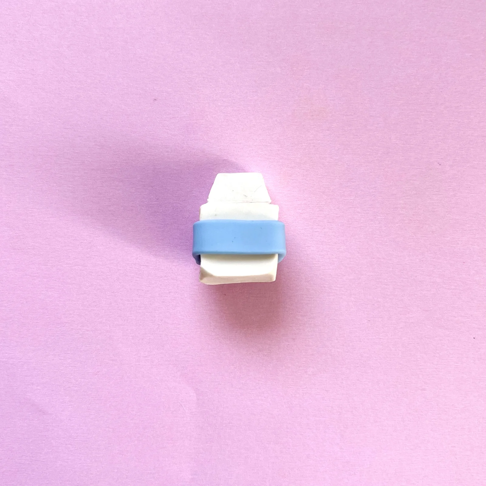 Step 2 of the mini clay food erasers tutorial: roll and flatten blue clay for the label