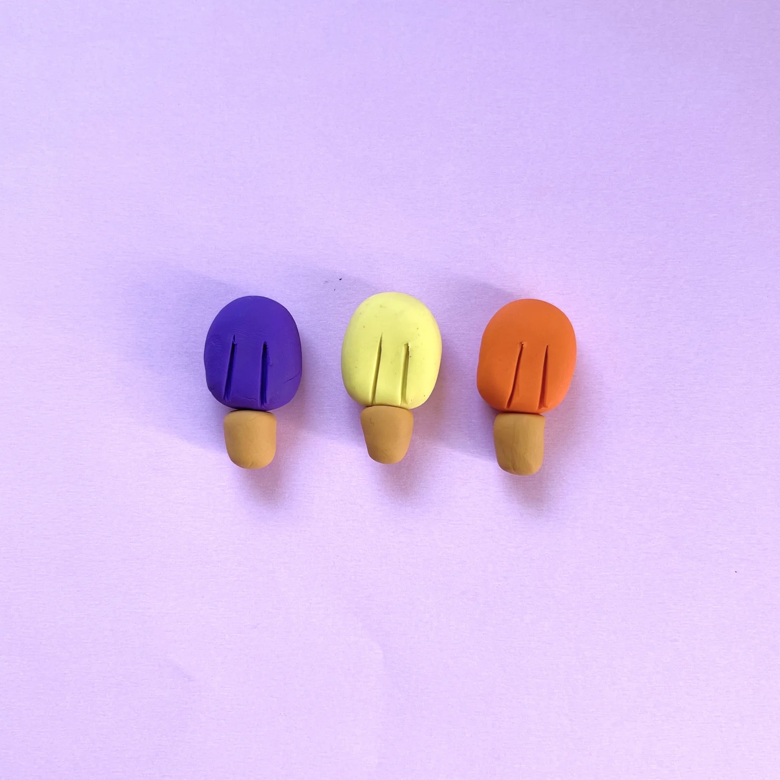 Step 3 of the mini clay food erasers tutorial: attach an oval stick to each ice pop