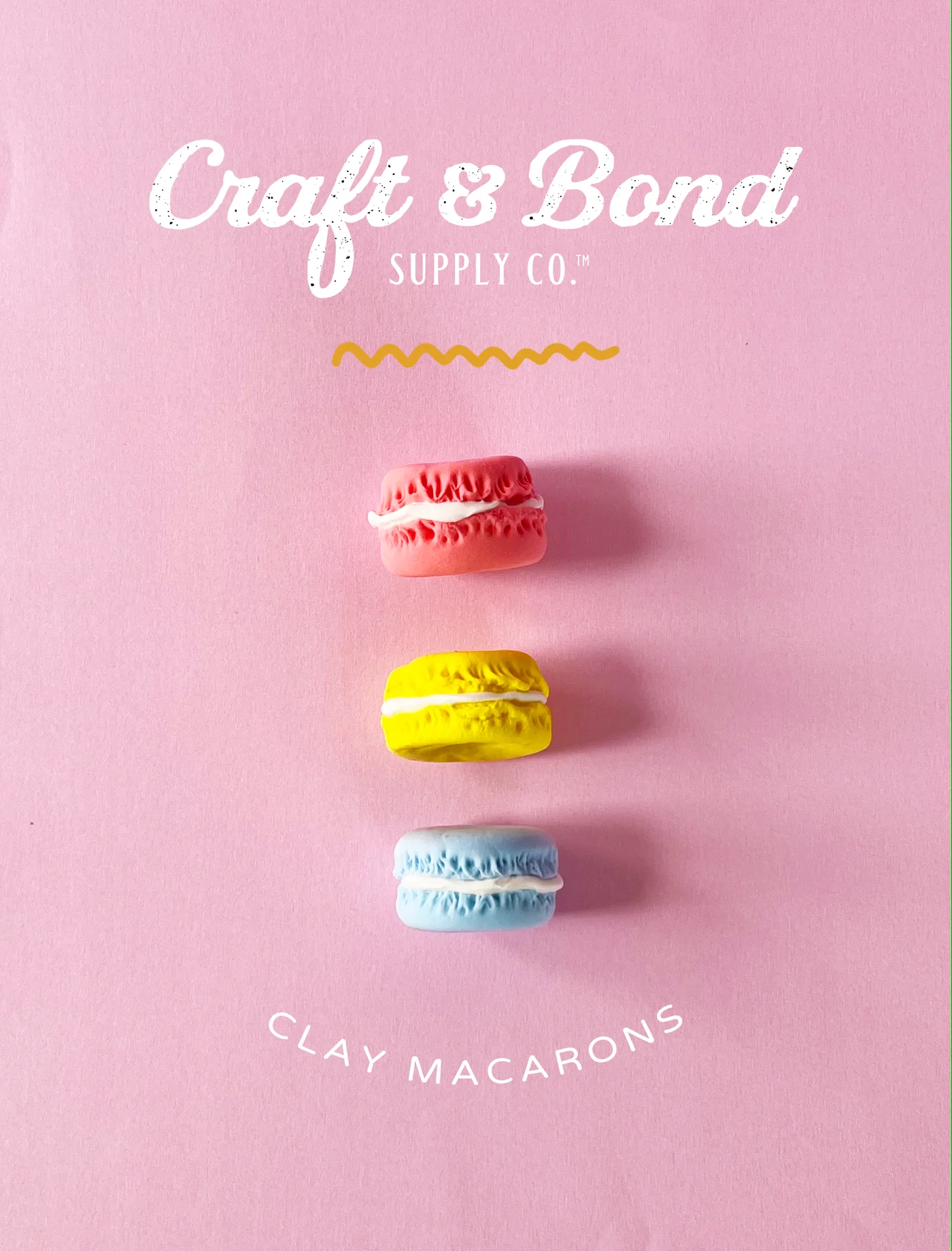 Pastel air-dry clay macarons in pink, blue, yellow, purple, and green, lined up in a gradient