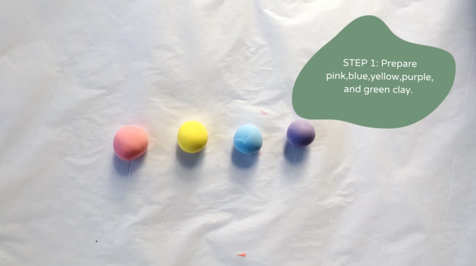 Step 1 of the DIY clay macarons tutorial: Prepare pink, blue, yellow, purple, and green clay.