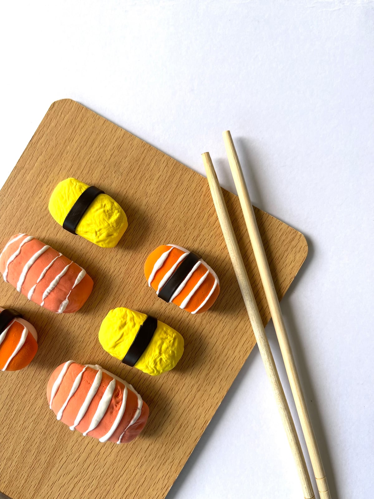 Clay nigiri lined up in a row after drying