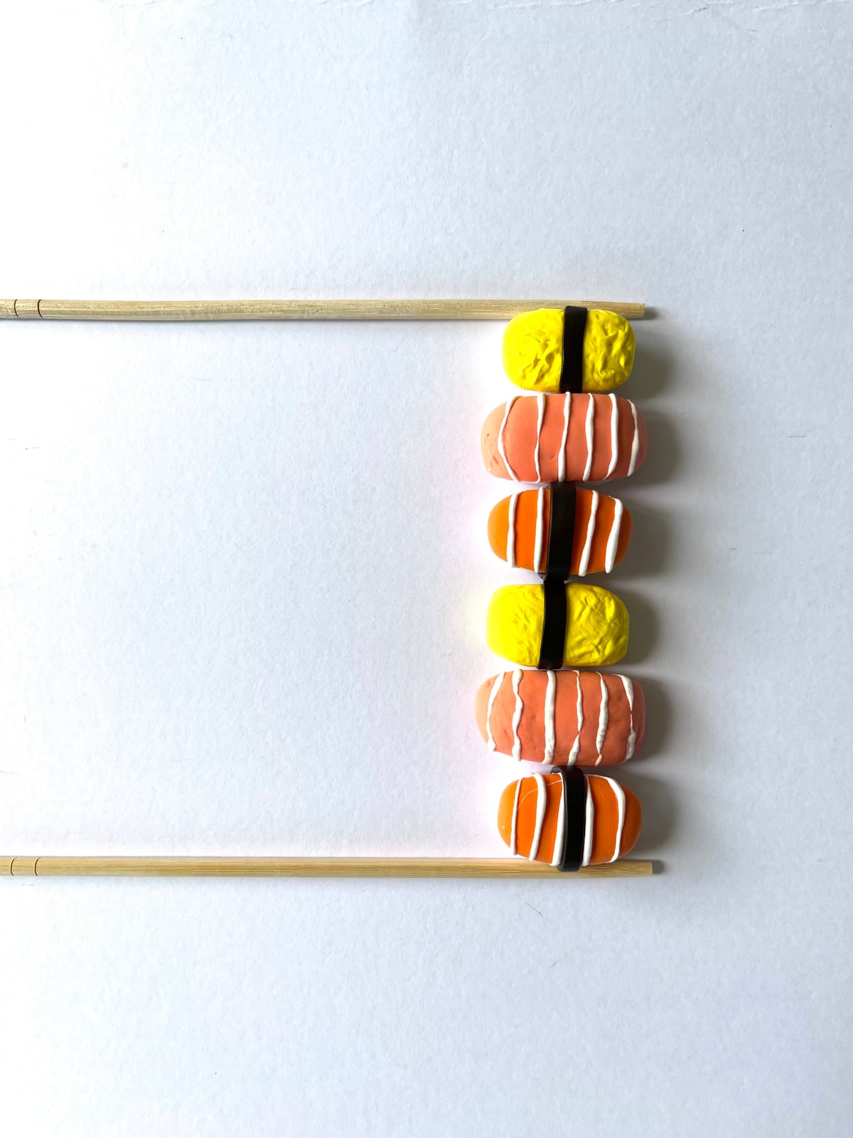 All three kinds of clay sushi styled together, salmon, tamago, and tuna