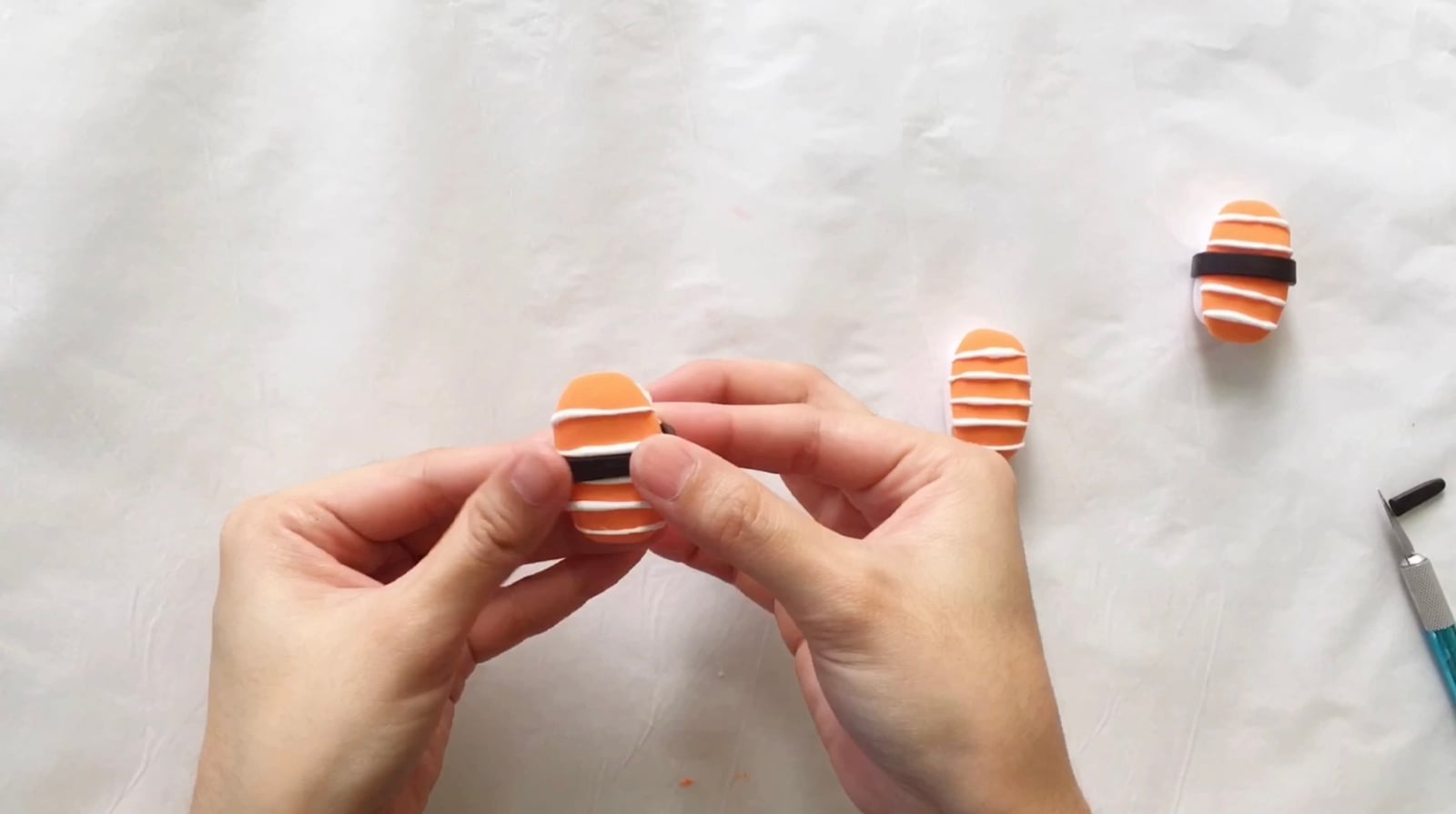 Step 4 of the DIY clay sushi tutorial: Use black clay for the seaweed wrap.