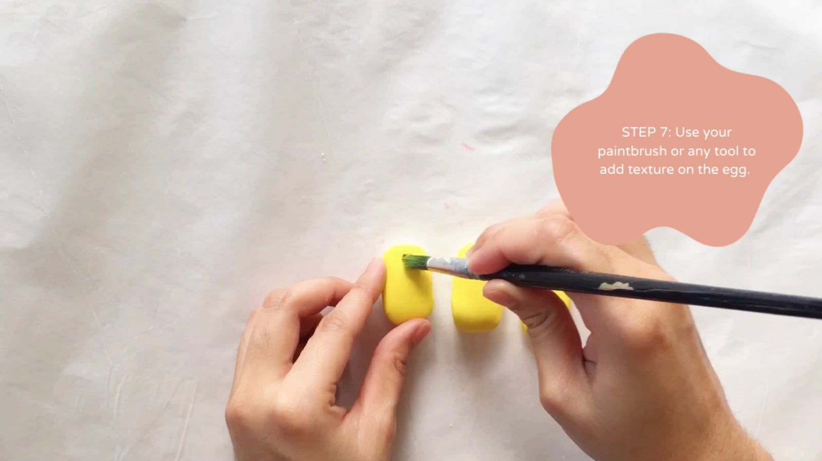 Step 7 of the DIY clay sushi tutorial: Use your paintbrush or any tool to add texture on the egg.