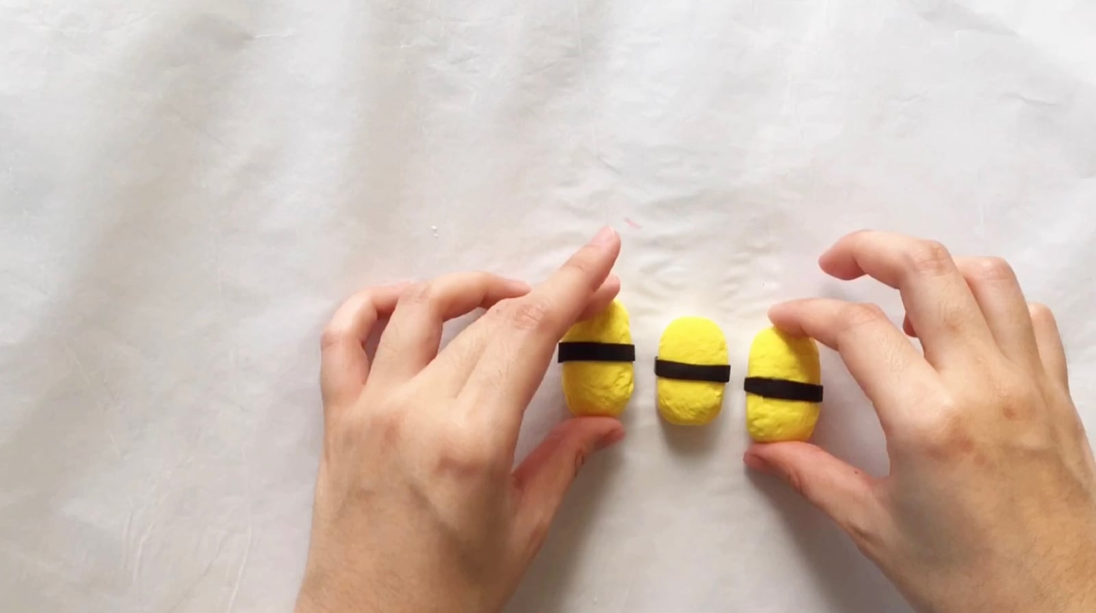 Step 8 of the DIY clay sushi tutorial: Add black clay for the seaweed wrap.