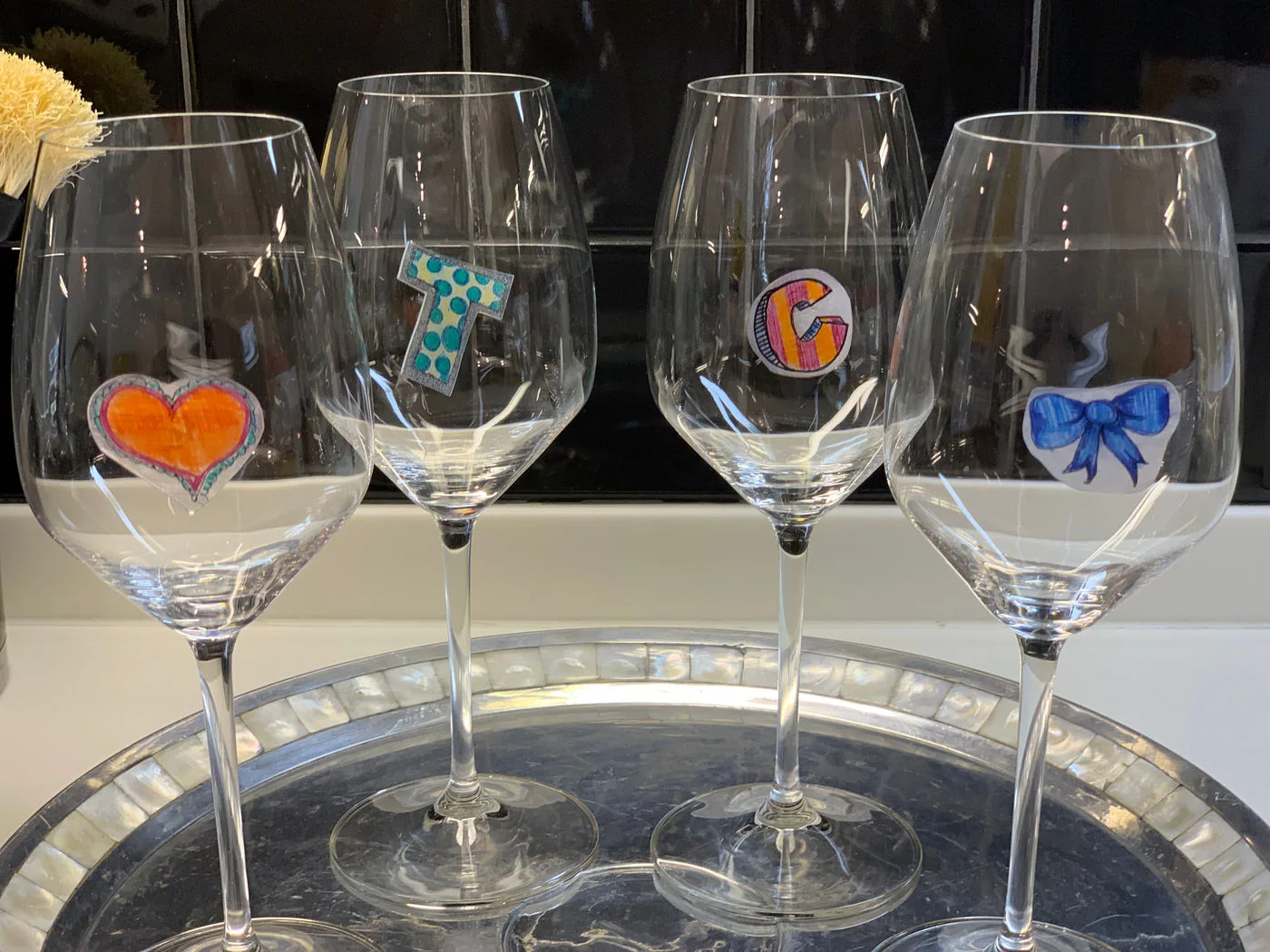 Making shrinky dink wine glass markers on a girls' trip