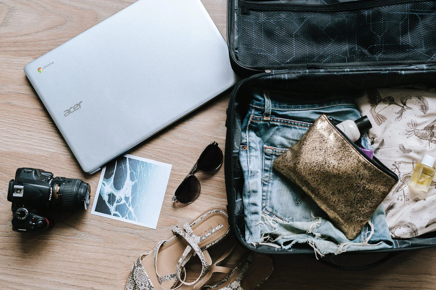A traveler consulting a phone and notebook while planning the next leg of a trip